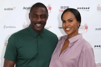 Sonya Nicole Hamlin standing confidently, smiling in professional attire