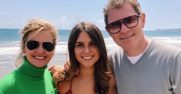 TV host Kate Connelly with Bobby Flay and daughter Sophie at the beach, capturing a happy family moment.