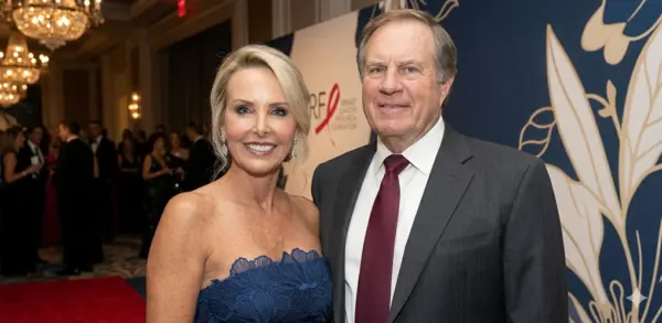 Debby Clarke Belichick standing confidently in a serene outdoor setting, reflecting her calm, private, and composed personality.