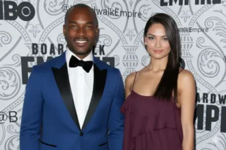 Berniece Julien standing with a male companion at a public event, both dressed elegantly