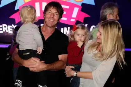 Dennis Quaid holding his young twins Thomas Boone Quaid and Zoe Grace Quaid, showing their close family bond and private upbringing.