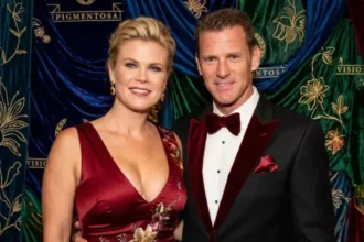 “David Sanov standing with his wife Alison Sweeney, both smiling together in a casual setting.”
